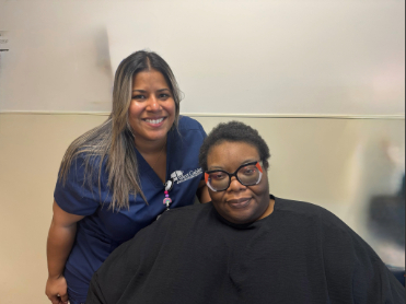 Evelyn and therapist smiling at camera