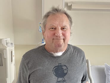 Herman Cook smiles after rehabilitation.