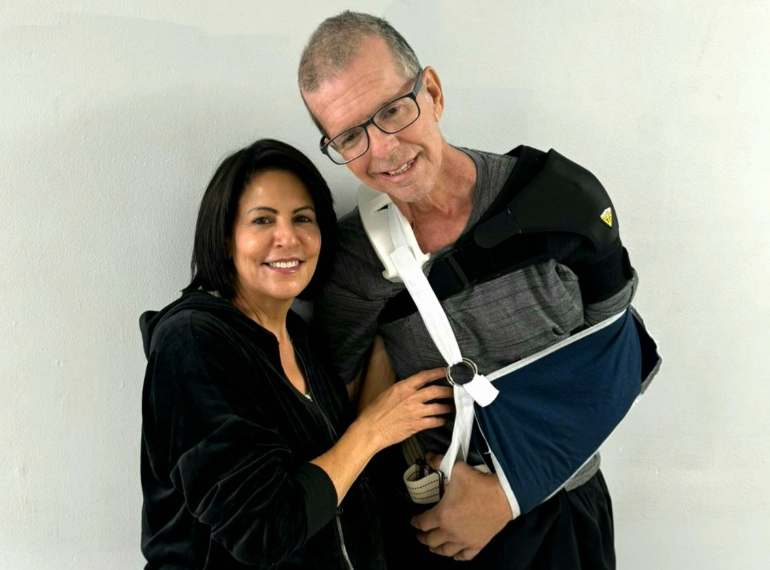 Woman and man smiling at camera