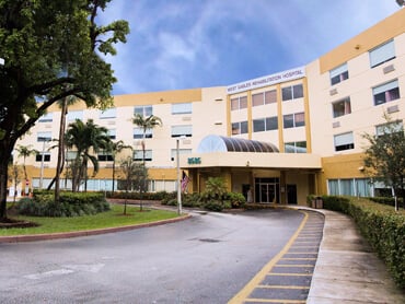 Exterior view of hospital taking from street level.