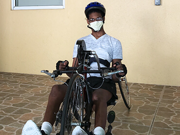 Jonathan sitting in his hand-cycling bike.